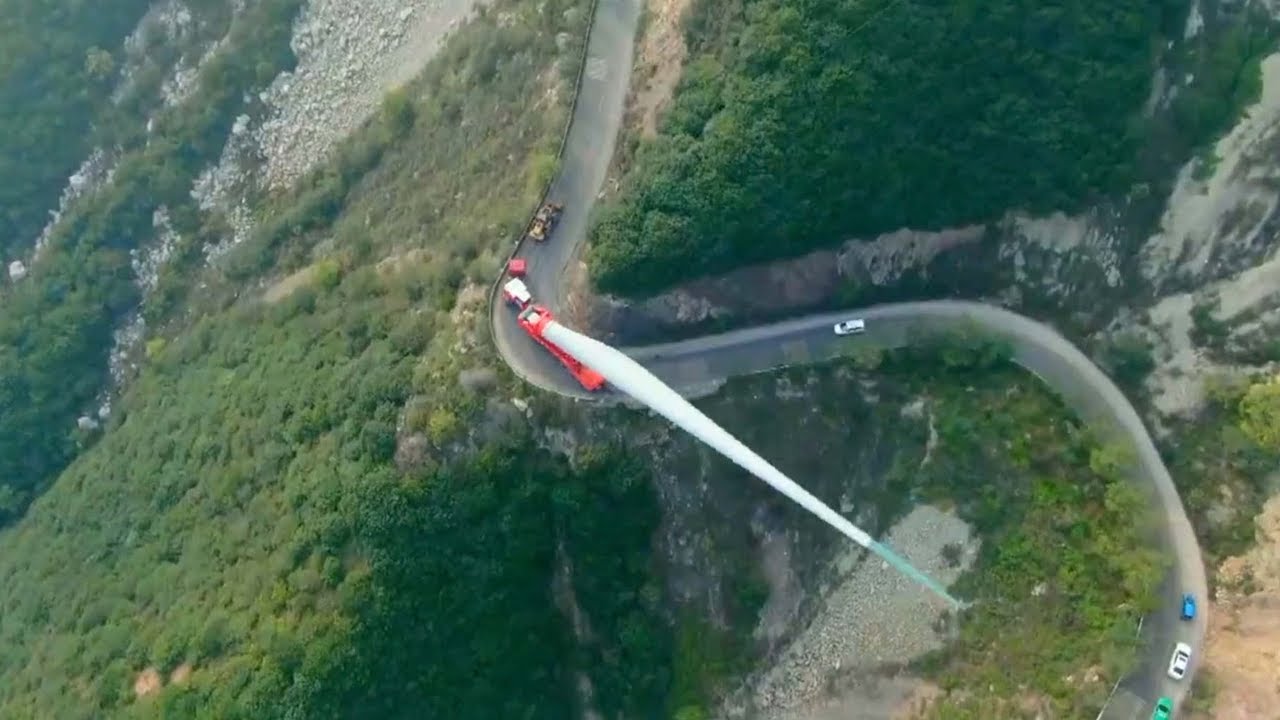 How are wind turbine blades transported to mountains?